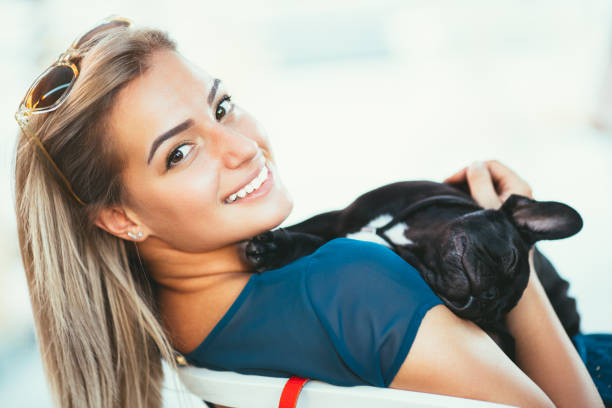 istock Woman with dog in cafe 838310904