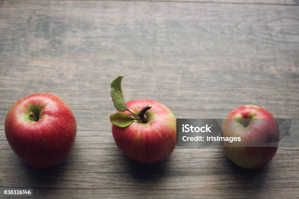 Autumn Season Still Life With Apples Over Rustic Wooden Background Stock Photo - Download Image Now