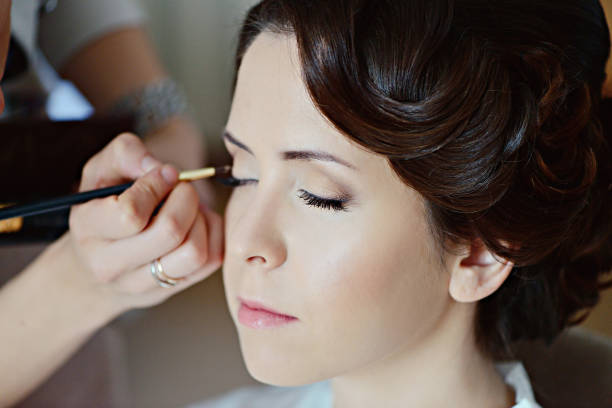 istock Wedding makeup artist making a make up for bride 838337410