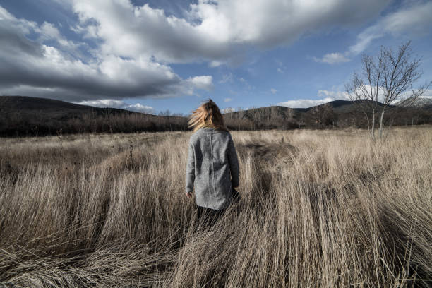 istock Woman posing in dried mountains field 838348866