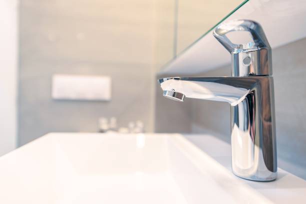 istock Modern Sink Faucet Closeup 838350456