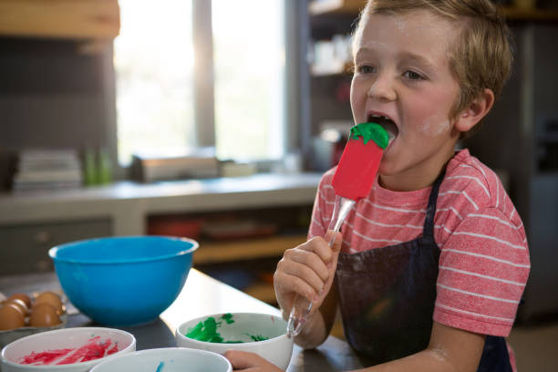 istock Boy holding green batter on spatula 838356794