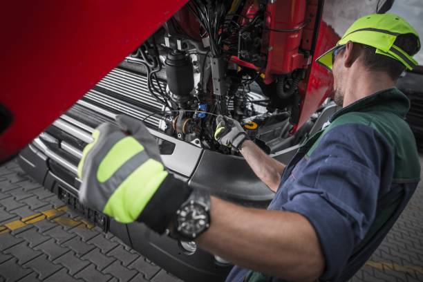 Truck Service Oil Level Check Truck Service Oil Level Check by Caucasian Worker Technician. Semi Truck Maintenance. engine failure stock pictures, royalty-free photos & images