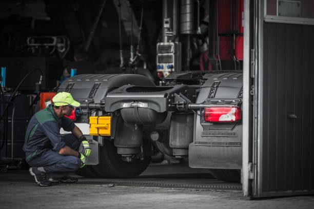 Truck Service Technician Job Truck Service Technician Job. Caucasian Truck Mechanic Checking on Semi Truck Tractor. engine failure stock pictures, royalty-free photos & images