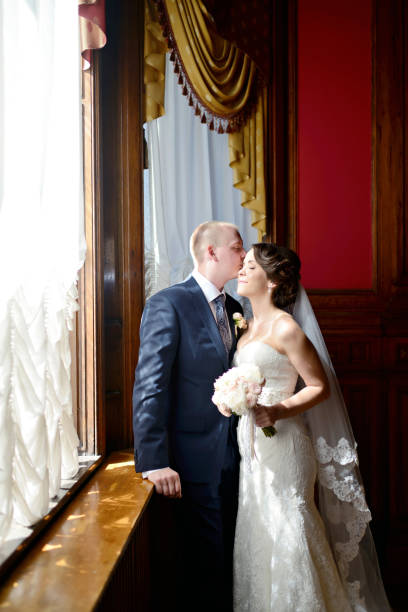istock Wedding couple indoors is hugging each other 838366206