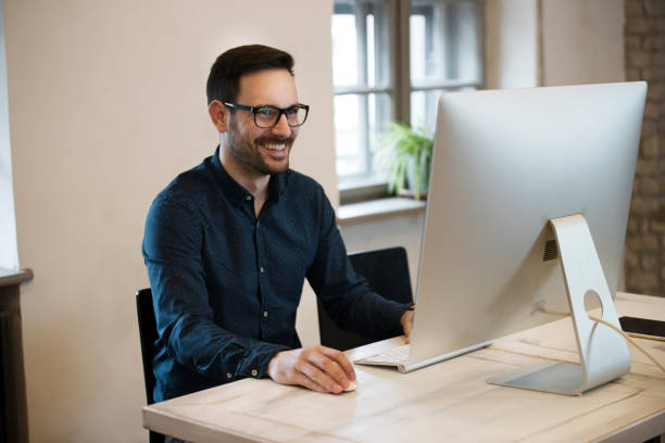 istock Portrait of handsome young designer working on computer 838369298