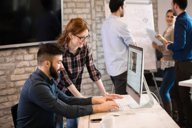 istock Group of young designers working as team 838369804