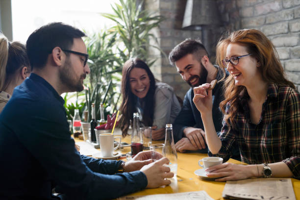 istock Group of young coworkers socializing in restaurant 838371290