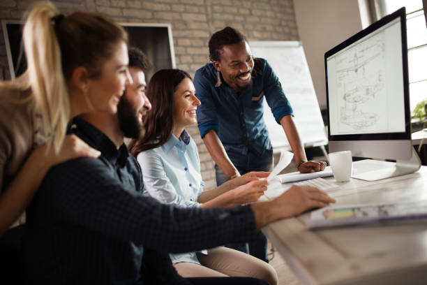 istock Group of young designers working as team 838376128
