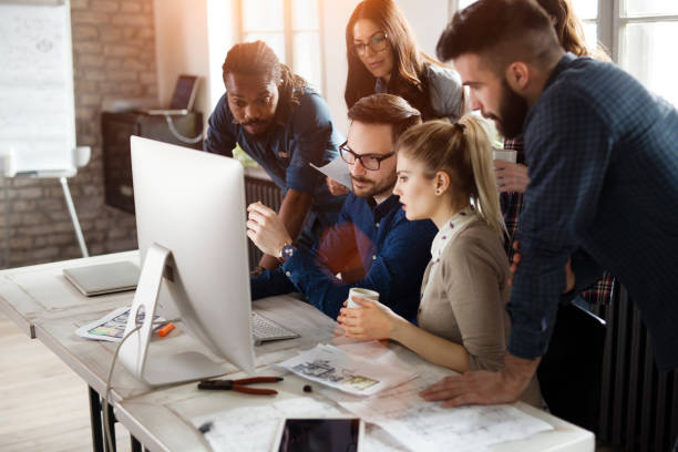 istock Group of young designers working as team 838376318