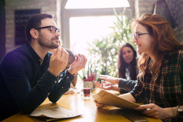 istock Group of young coworkers socializing in restaurant 838376466