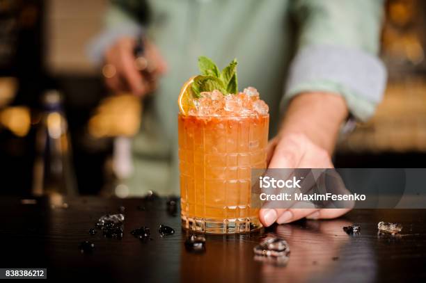 Bartender Finished Decorating His Cocktail Stock Photo - Download Image Now - Cocktail, Bartender, Alcohol - Drink