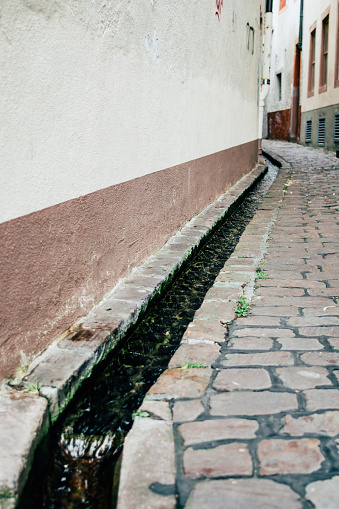 Small canal called a bächle in the city Freiburg in Germany.