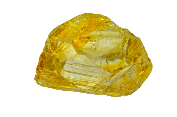Citrine gemstone. Cluster of several yellow quartz crystals on white background