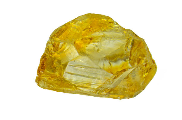 Citrine rock isolated on the white background. Citrine rock isolated on the white background. topaz stock pictures, royalty-free photos & images