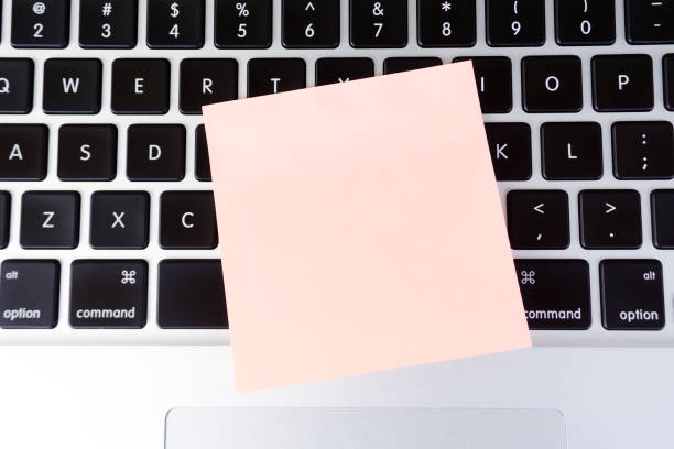 istock Sticky blank note on top of laptop keyboard 838399450