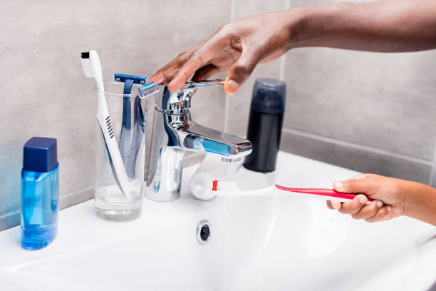 istock father and son washing tooth brush 838402044