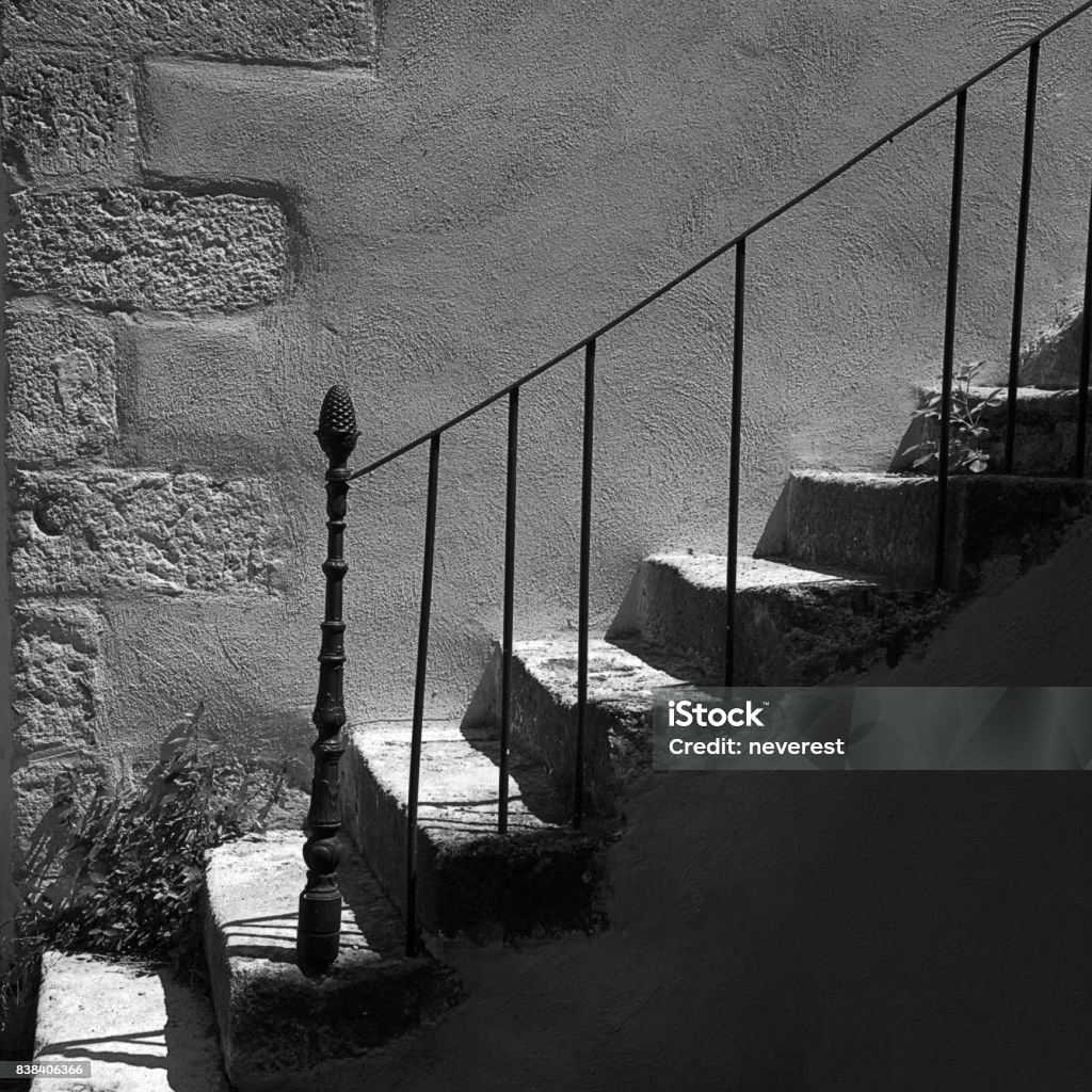 Stone stairway stone stairway sunlit in the summer in a provencal village Black And White Stock Photo