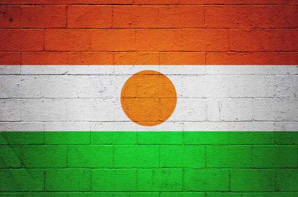Flag of Niger painted on a brick wall.