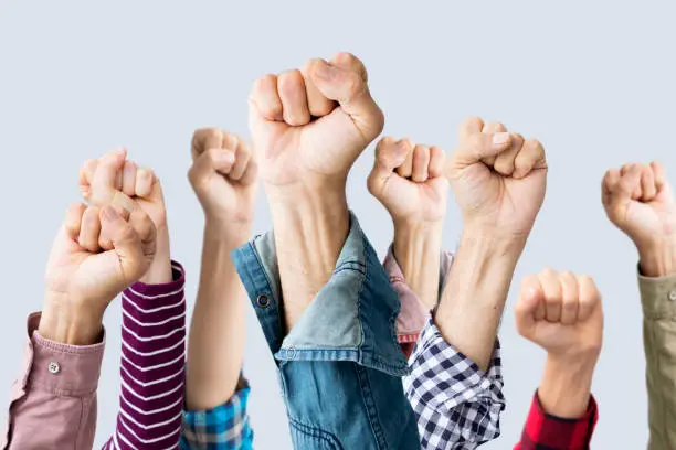 Photo of Group of fists raised in air