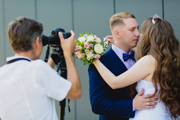 istock Photographer with Groom and Bride 838421108