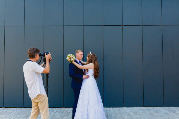 istock Videographer with Groom and Bride 838421326