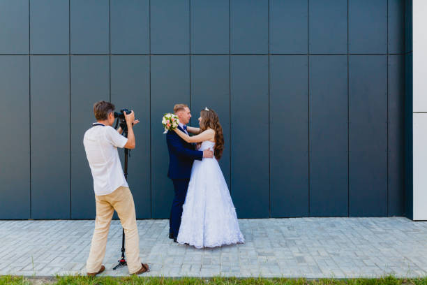 istock Videographer with Groom and Bride 838421374