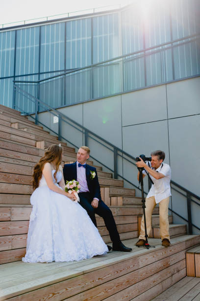 istock Photographer with Groom and Bride 838421456