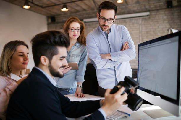 istock Group of young perspective designers working with camera 838421730