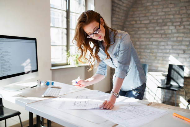 istock Portrait of young female architect working on project 838421876