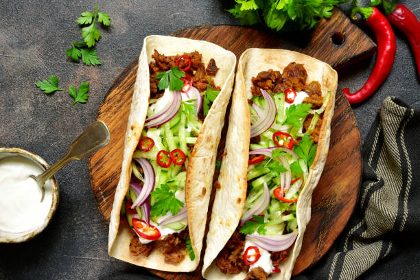 istock Mexican tacos with pulled beef,fresh cucumber and yogurt 838431498