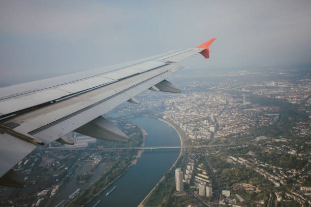 istock Airplane Wing in Flight on City 838432086