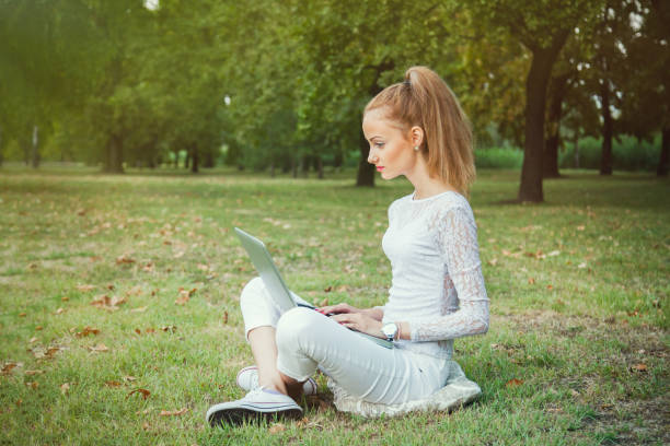 young student learn from notebook stock photo