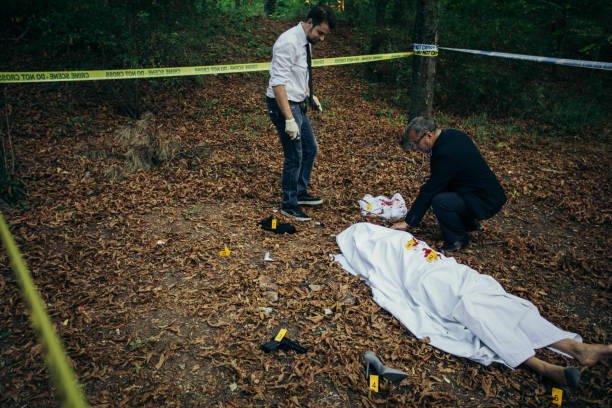 istock Police examining dead body 838447520