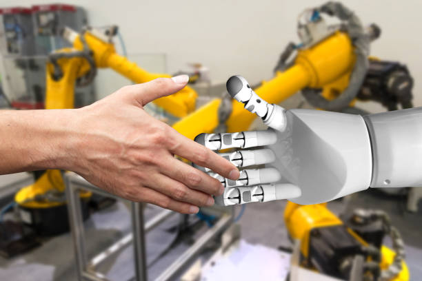 istock Artificial intelligence (AI) advisor or robo-adviser technology. Shaking hands of male and automation robot with blur automation arm in smart factory background. 838450824