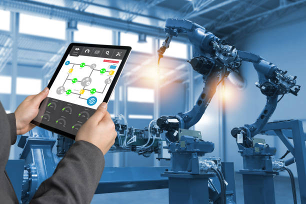 istock Engineer hand using tablet, heavy automation robot arm machine in smart factory industrial with tablet real time process control monitoring system application. Industry 4th iot concept. 838450830