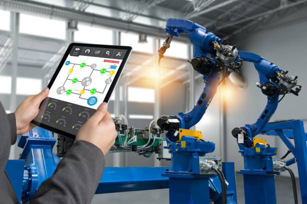 istock Engineer hand using tablet, heavy automation robot arm machine in smart factory industrial with tablet real time process control monitoring system application. Industry 4th iot concept. 838450834