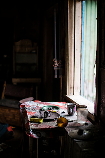 The interior of the abandoned, obsolete and ruined house in the small village in Belarus, Eastern Europe. Many houses in the counrty are abandoned, have no owners and going to be destroyed by time. Sometimes, homeless people using them for temporary living.