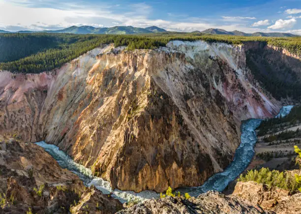 A wide, sweeping turn of the raging Yellowstone River below Inspiration Point in Yellowstone National Park, Wyoming