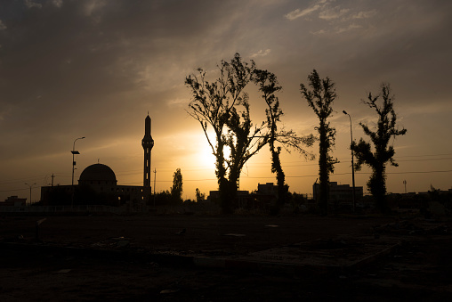 by the minaret at sunset