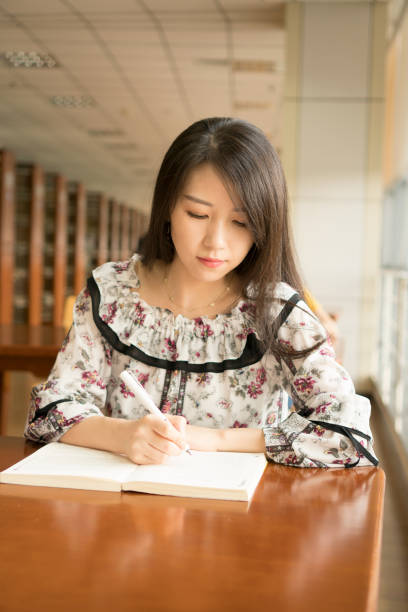 istock asian girl in library 838467010