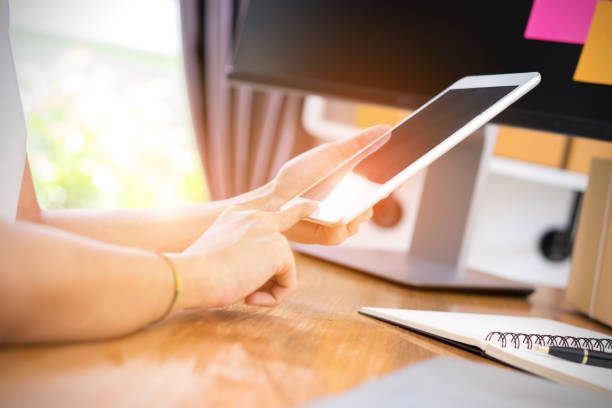 istock Closeup,Young girl freelancer business private working at home office using tablet with note and packaging delivery online market on purchase orders to customer 838468856