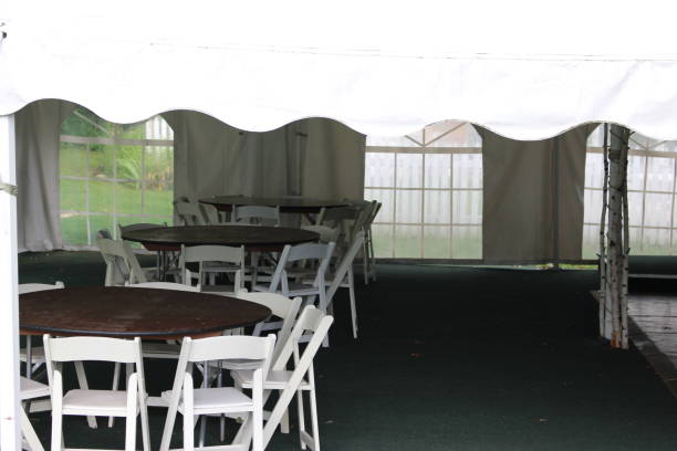 istock party tent with tables and chairs 838469914