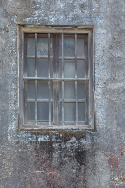 istock exterior view of old wall with closed glass window 838476380