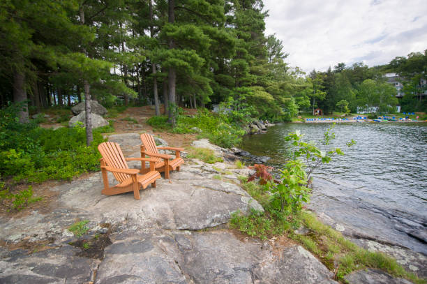 istock Muskoka chairs on a rock formation 838477456