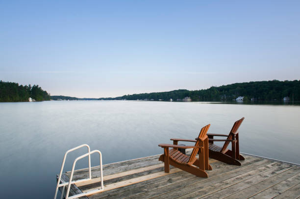 istock Muskoka chairs on a wooden dock 838477520