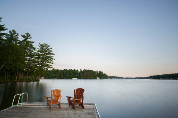 istock Muskoka chairs on a wooden dock 838477536