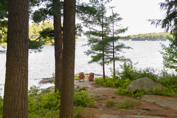 istock Muskoka chairs on a rock formation 838477690