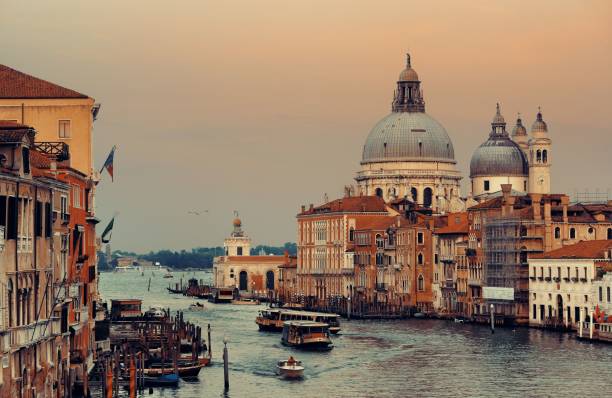 istock Venice Grand Canal sunrise and boat 838478186