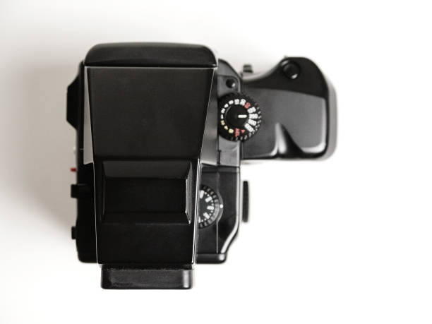 istock Top view of a vintage medium format camera with motorized grip on a white background 838478530